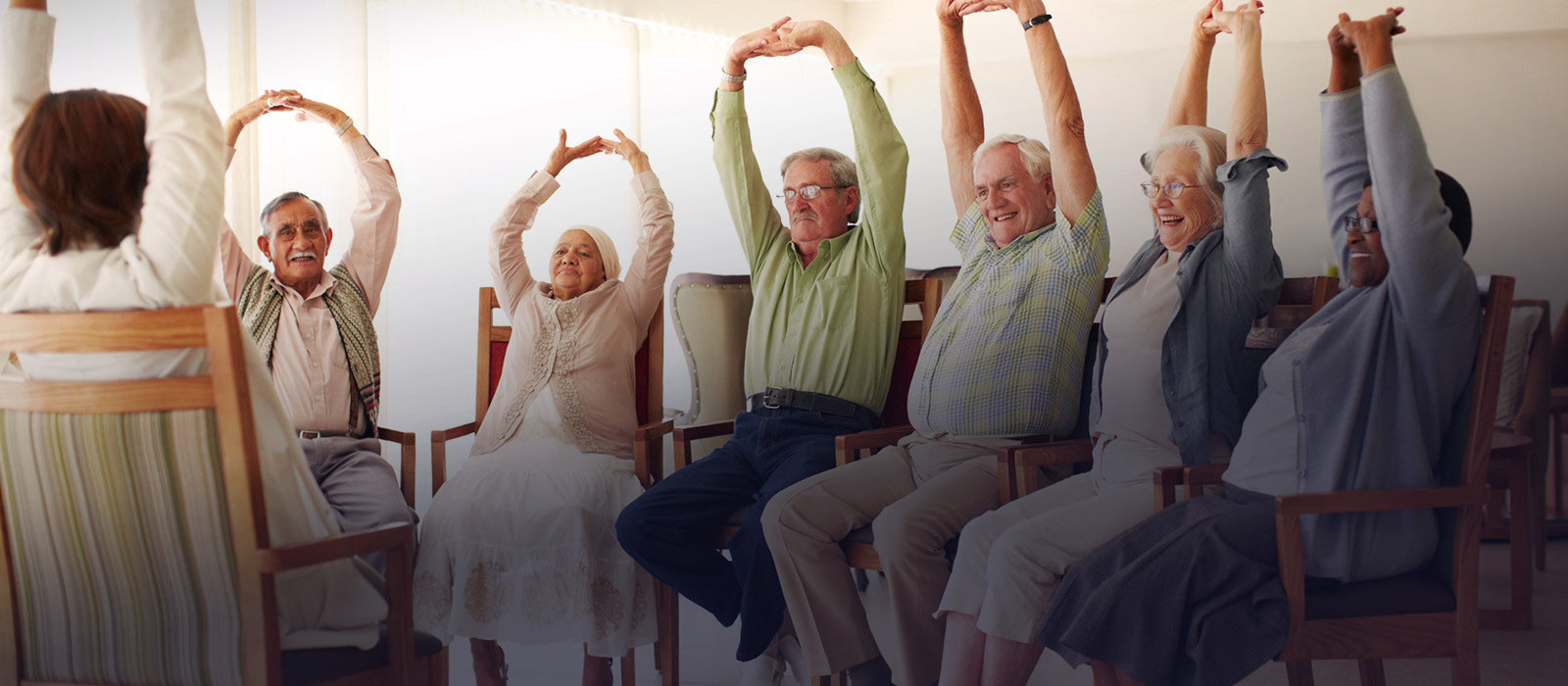 Image of elderly people doing light exercise